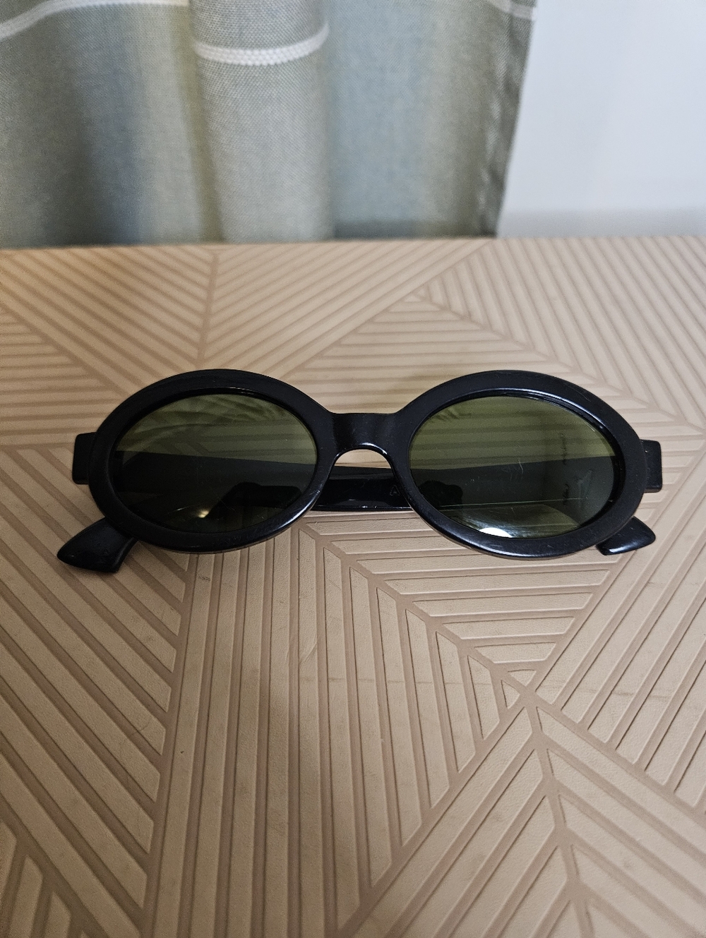 Polaroid Black Frame Sunglasses with Green Lenses